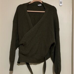 Sweater fits like a M. Thick comfy. Wrap waist.